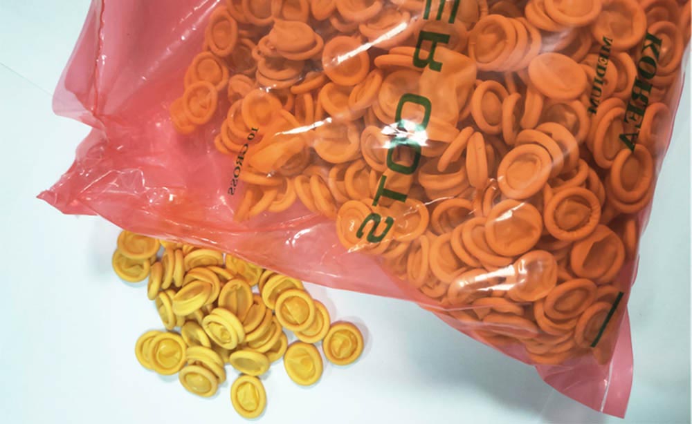 Lettini industriali monouso in lattice antiscivolo giallo arancio