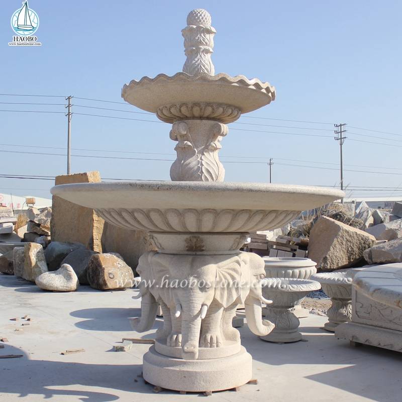 Fontana a ruota idraulica in marmo decorato da giardino con intaglio di elefanti
