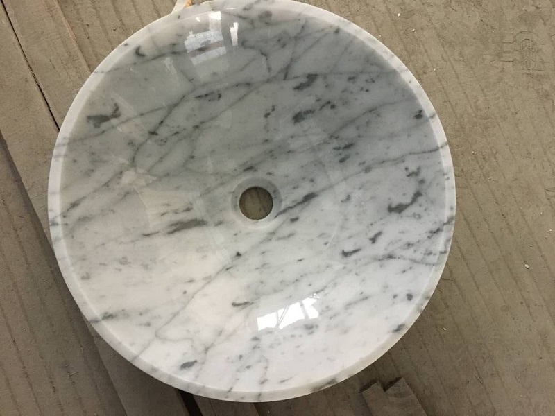 Lavabo e lavabo in marmo bianco carrara di forma rotonda
