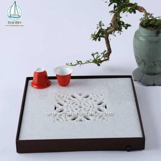 Vassoio da tè in pietra quadrata con intaglio vuoto di design in marmo bianco Cina
