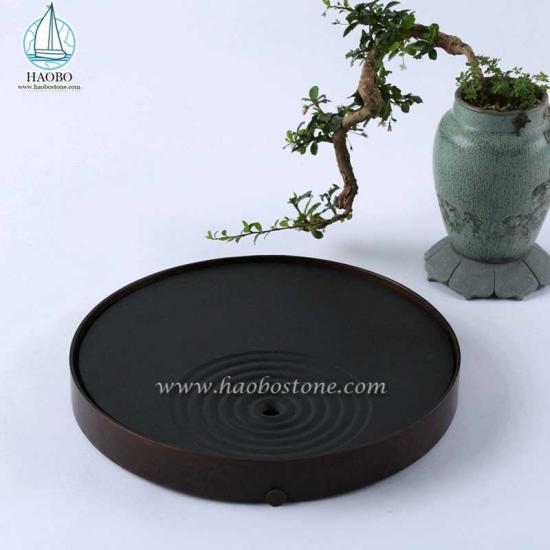 Vassoio da tè in pietra a forma rotonda con intaglio in pietra di granito nero
